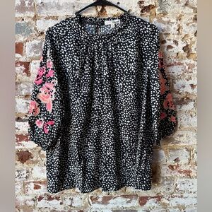 Chic Black and White Blouse with Pink Floral Sleeves